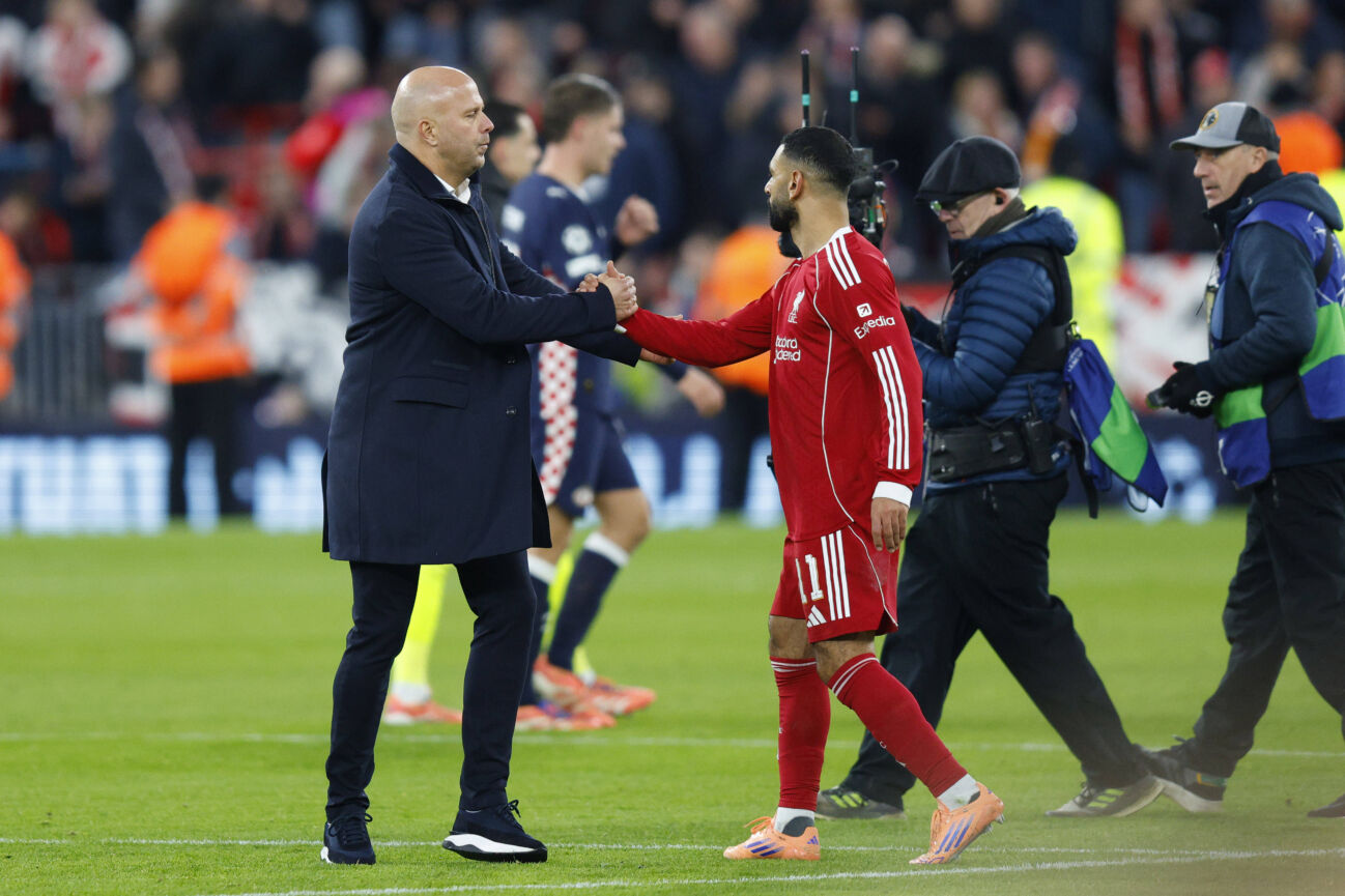 Liverpool, England, 26th November 2025. Arne Slot, Manager of Liverpool and Mohamed Salah of Liverpool shake hands after the Liverpool vs PSV Eindhoven UEFA Champions League match at Anfield, Liverpool. Picture credit should read: James Baylis Sportimage EDITORIAL USE ONLY. No use with unauthorised audio, video, data, fixture lists, club league logos or live services. Online in-match use limited to 120 images, no video emulation. No use in betting, games or single club league player publications. SPI_077_JB_Liverpool_PSV SPI-4311-0077
